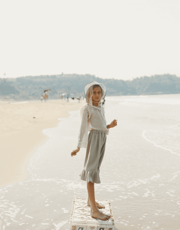 the Marya Blouse in Undyed paired with the Claudia Skirt by the brand Yoli & Otis