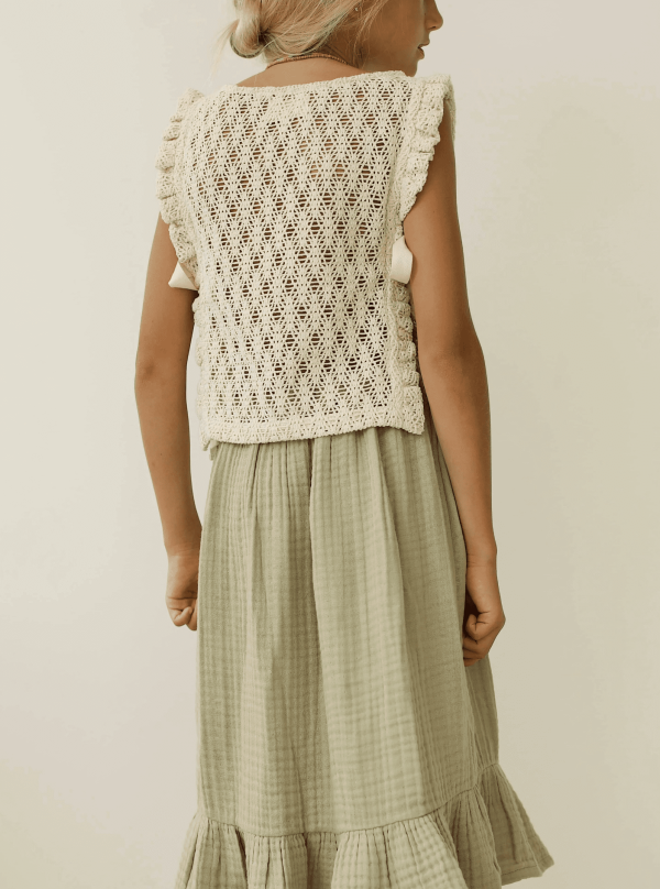 the Nila top in Undyed paired with the Claudia Skirt by the brand Yoli & Otis