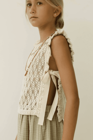 the Nila top in Undyed paired with the Claudia Skirt by the brand Yoli & Otis