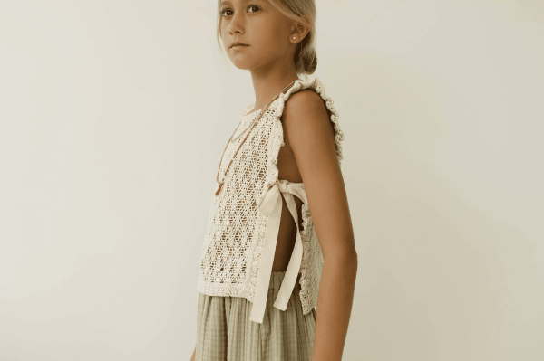 the Nila top in Undyed paired with the Claudia Skirt by the brand Yoli & Otis