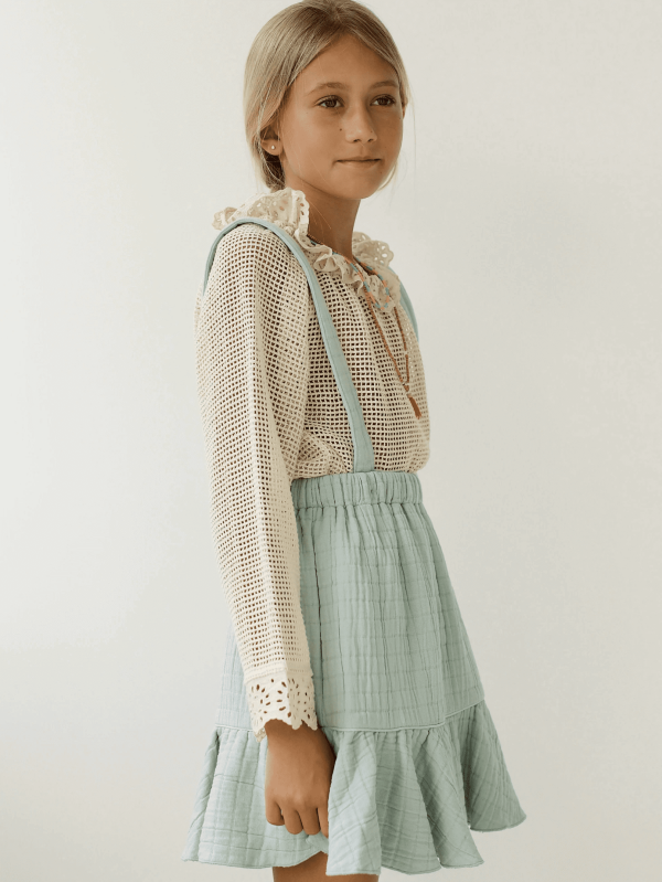 the Romeo Skirt in Duck Egg Blue paired with the Marya Blouse by the brand Yoli & Otis