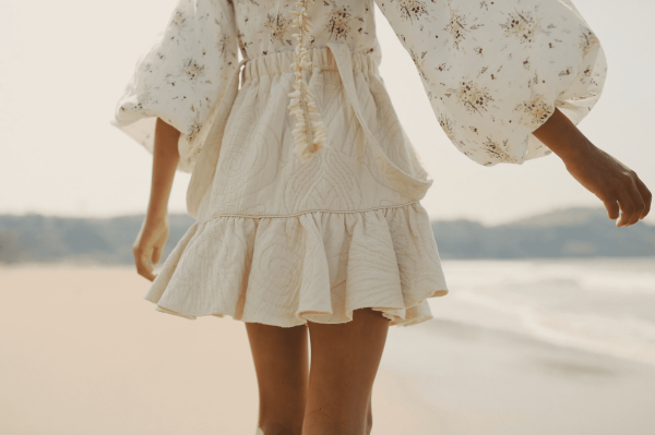 the Romeo Skirt in Undyed paired with the Louilian blouse by the brand Yoli & Otis