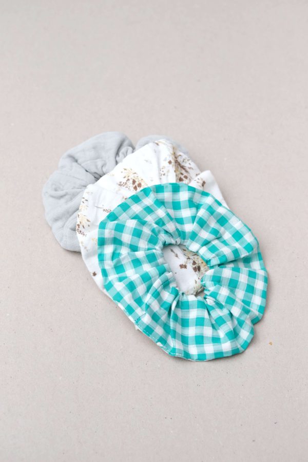 the Scunchie in Apple Plaid, Vintage Floral & Duck Egg Blue by the brand Yoli & Otis