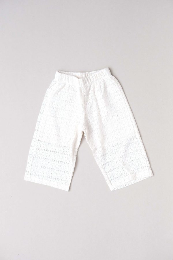 the Tallan Trousers in Undyed Crochet by the brand Yoli & Otis