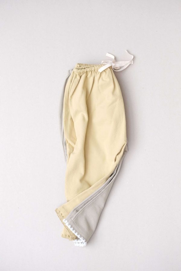 the Valan Trousers in Parsnip & Dried Herb by the brand Yoli & Otis