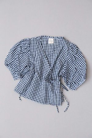 the Ella Wrap Top in Black Gingham by the brand The Bare Road