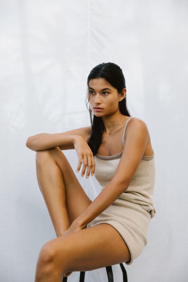 woman wearing the Emma Knit Shorts & Singlet in Bone by the brand The Bare Road