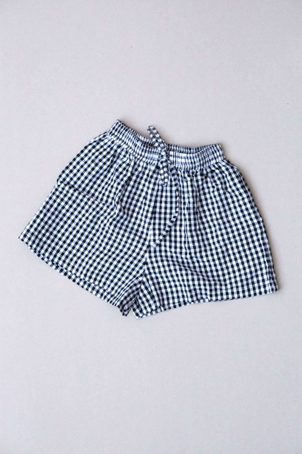 the Maddie Shorts in Black Gingham by the brand The Bare Road