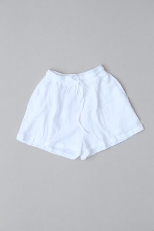 flatlay of the Maddie Shorts in White Textured by the brand The Bare Road