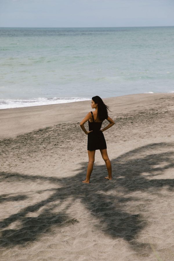 woman wearing the Sunny Hemp Dress in Black by the brand The Bare Road