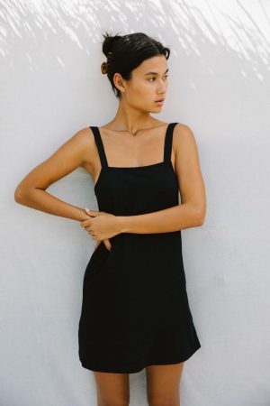 woman wearing the Sunny Hemp Dress in Black by the brand The Bare Road