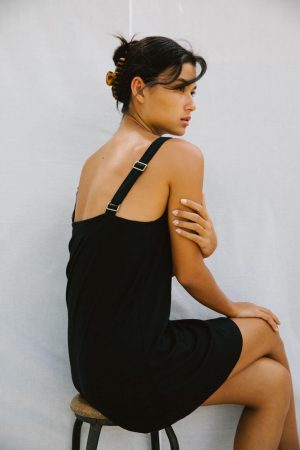 woman wearing the Sunny Hemp Dress in Black by the brand The Bare Road