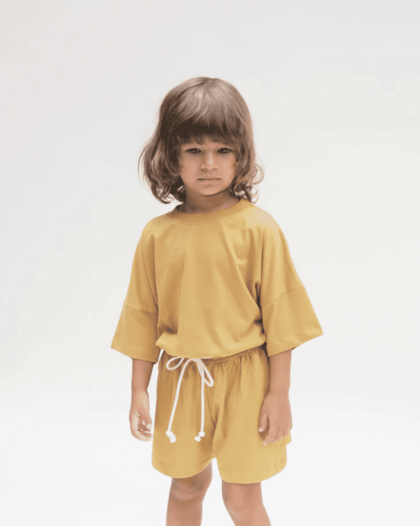 the Classic Shorts & the Oversized Tee in Mustard by the brand Summer and Storm
