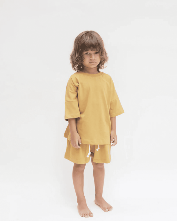 the Classic Shorts & the Oversized Tee in Mustard by the brand Summer and Storm