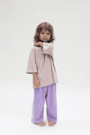 the Oversized Tee in Mushroom & the Racer Terry pants in Purple by the brand Summer and Storm