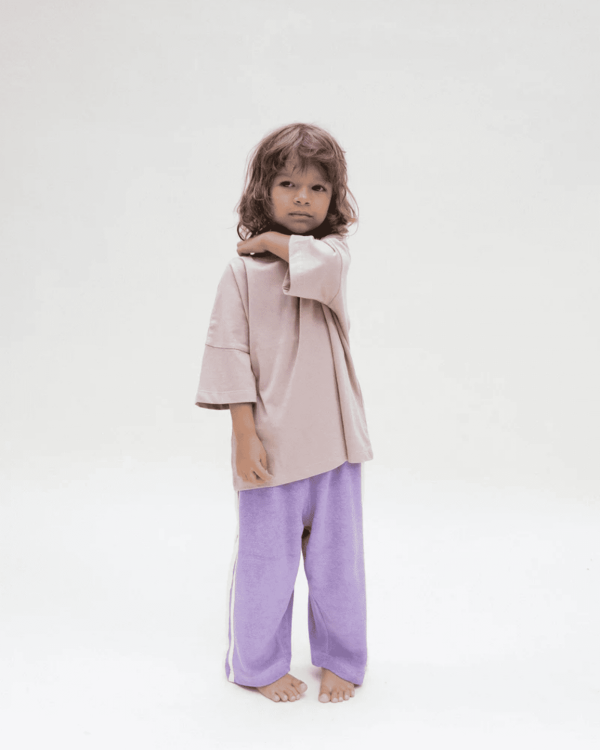 the Oversized Tee in Mushroom & the Racer Terry pants in Purple by the brand Summer and Storm