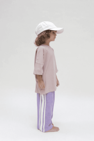 the Oversized Tee in Mushroom & the Racer Terry pants in Purple by the brand Summer and Storm