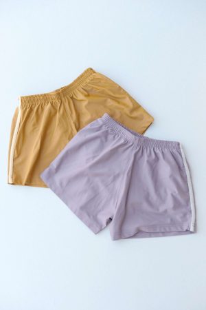 the Swim Shorts in Mauve and Mushroom / Mustard and Latte by the brand Summer and Storm