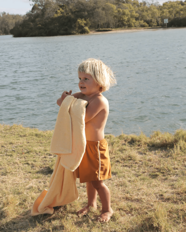 the Swim Shorts in Mustard and Latte by the brand Summer and Storm