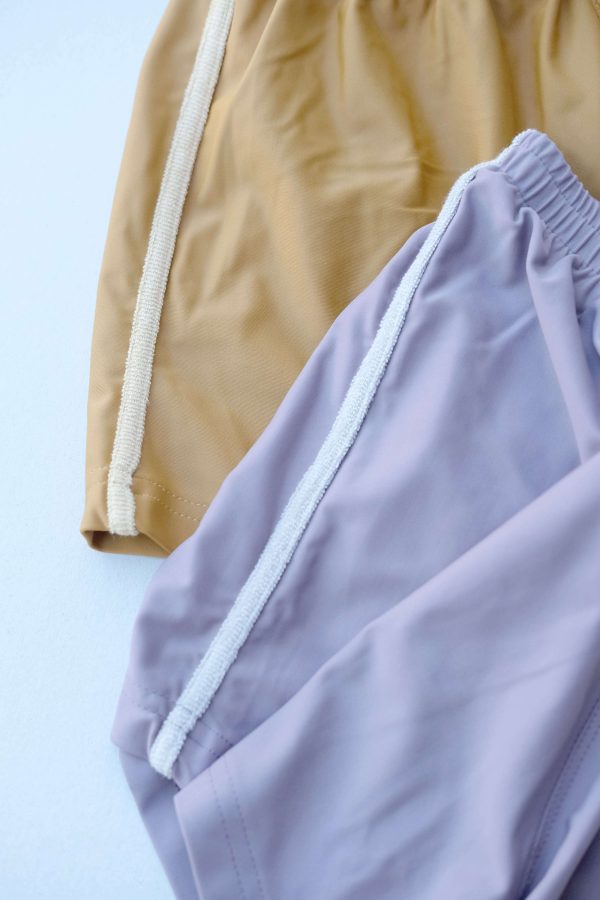 the Swim Shorts in Mustard and Latte / Mauve and Mushroom by the brand Summer and Storm