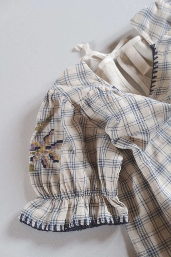 the organic cotton Estella Blouse in Tattersall Check by the brand LiiLU