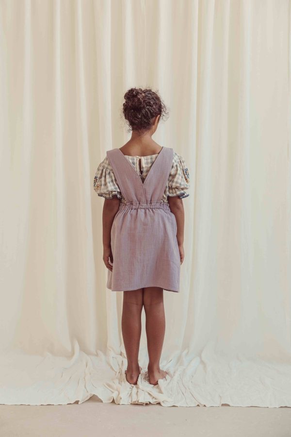 the organic cotton Estella Blouse in Tattersall Check paired with the Smilla Skirt in Lavender by the brand LiiLU