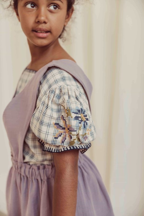 the organic cotton Estella Blouse in Tattersall Check paired with the Smilla Skirt in Lavender by the brand LiiLU