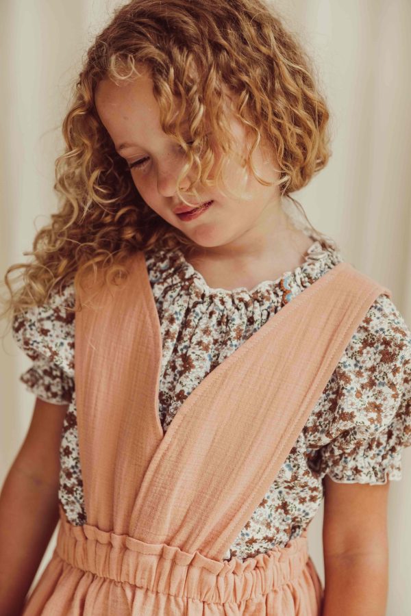 the organic cotton Josephine Blouse in Field Flowers paired with the Smilla skirt in Peach by the brand LiiLU