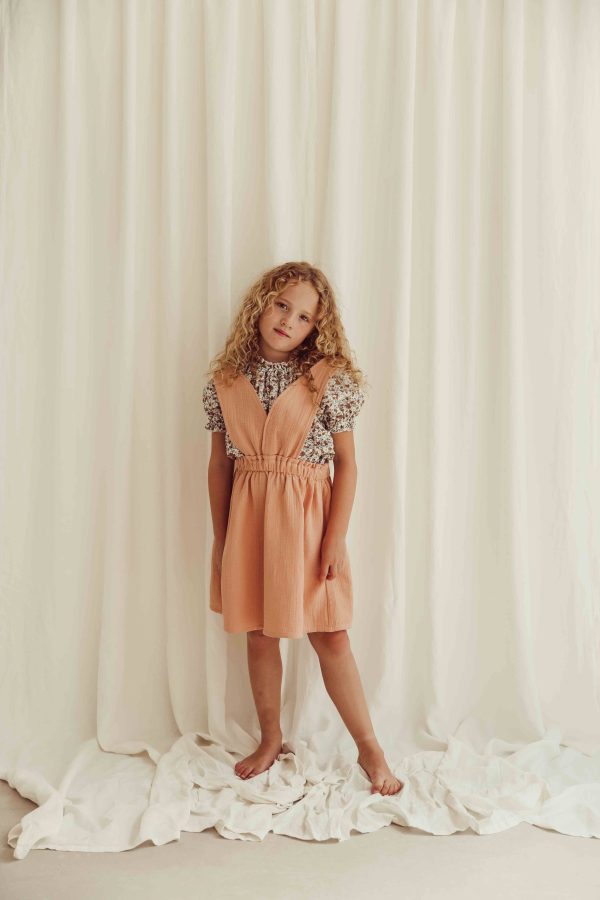 the organic cotton Josephine Blouse in Field Flowers paired with the Smilla skirt in Peach by the brand LiiLU