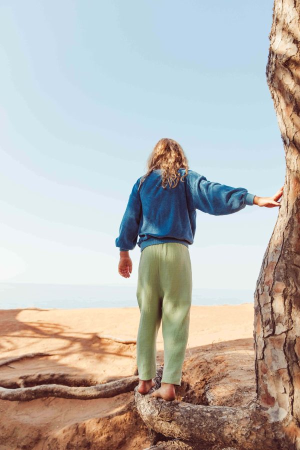 the organic cotton Levi Pants in Dryed Green paired with the Dante Sweater in Indigo Blue by the brand LiiLU