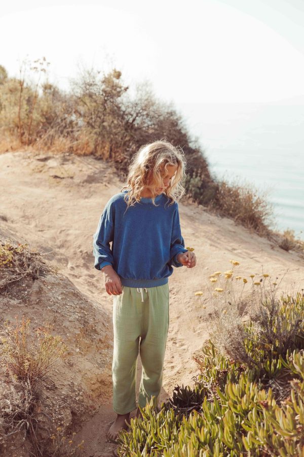 the organic cotton Levi Pants in Dryed Green paired with the Dante Sweater in Indigo Blue by the brand LiiLU