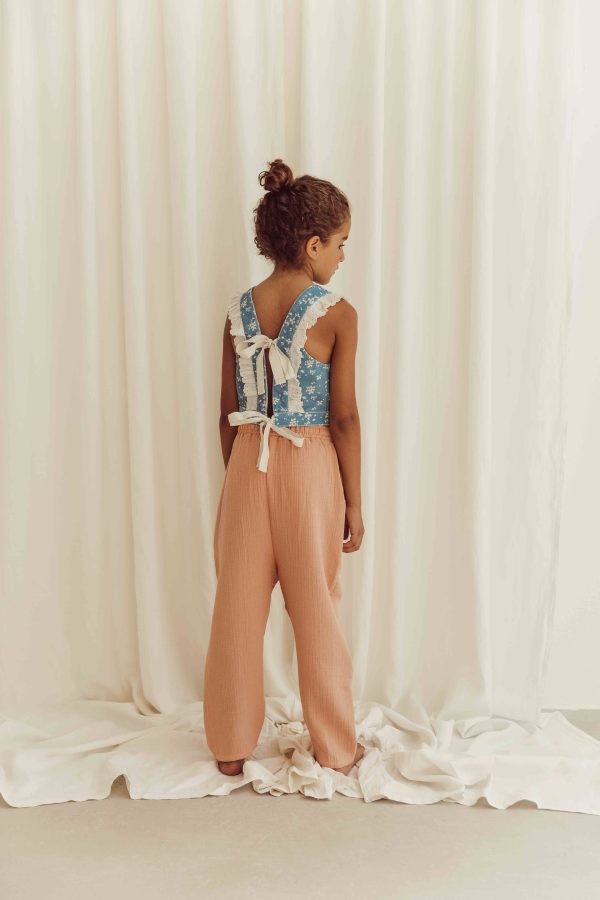 the organic cotton Levi Pants in Peach paired with the Alani Denim Top by the brand LiiLU