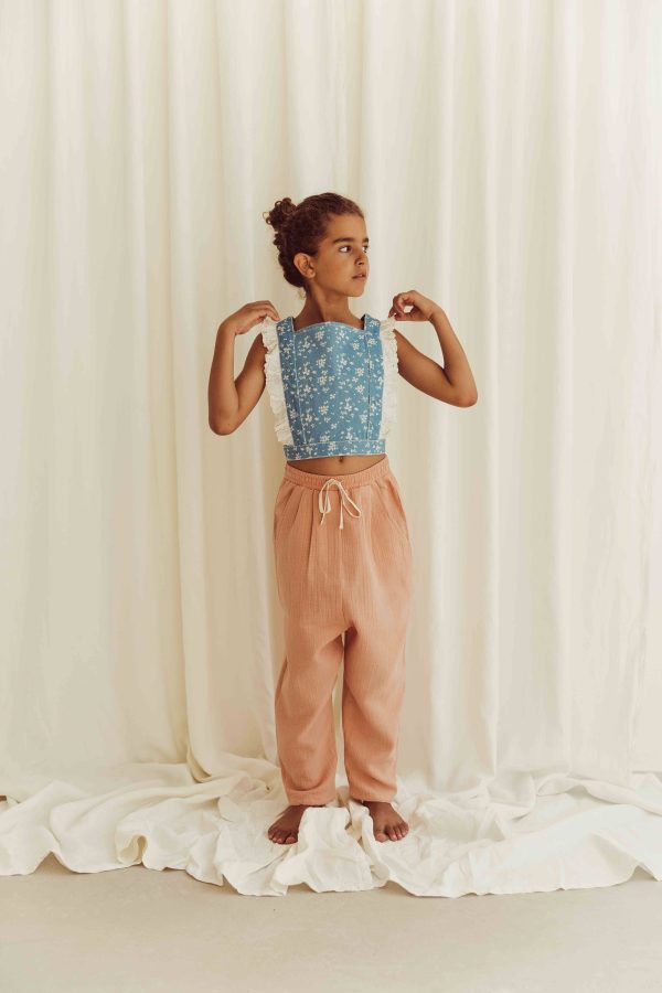 the organic cotton Levi Pants in Peach paired with the Alani Denim Top by the brand LiiLU