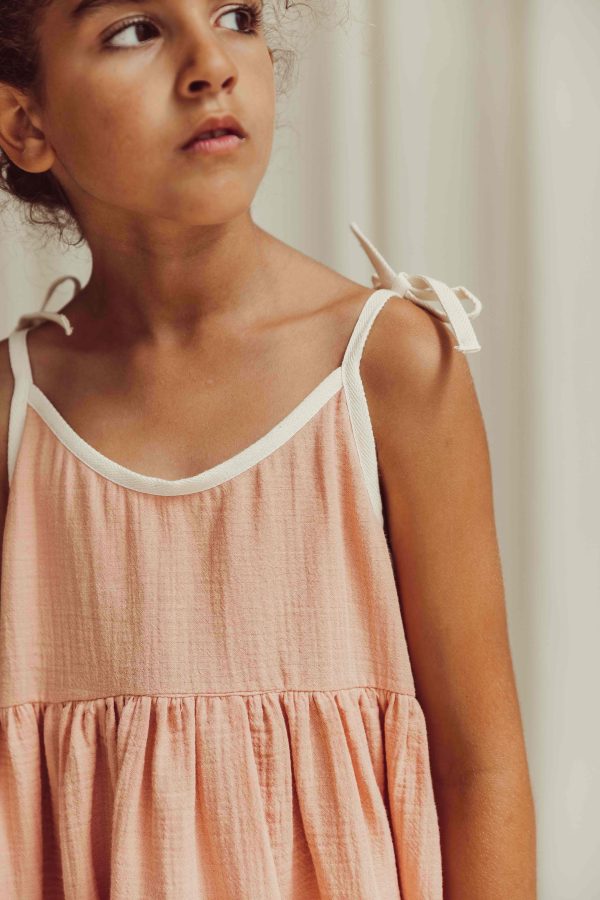 the organic cotton Louisa Dress in peach by the brand LiiLU