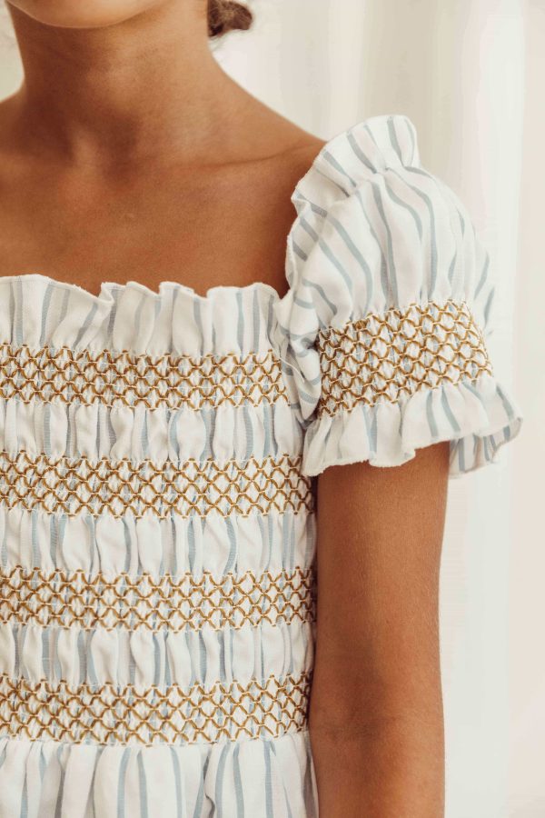 the organic cotton Smocked Striped Dress by the brand LiiLU