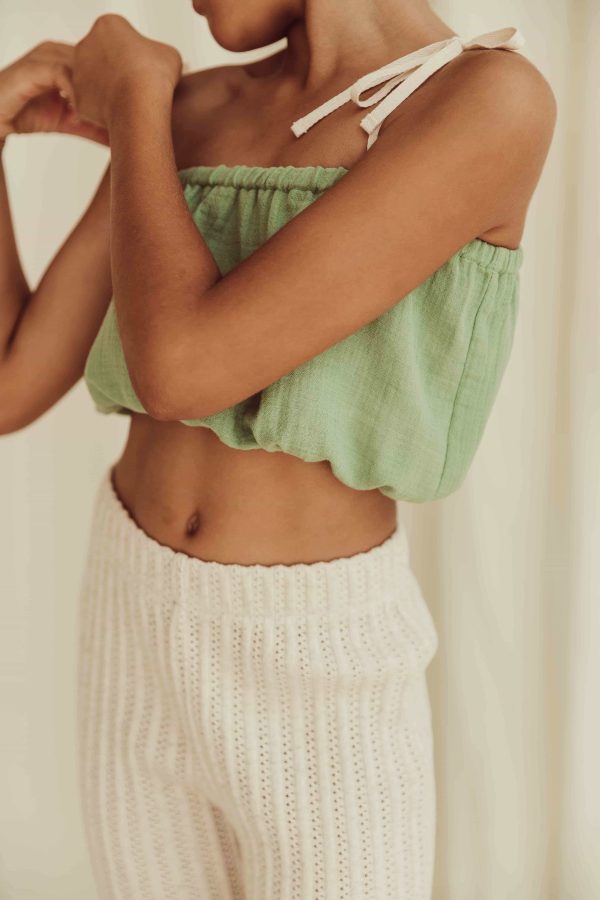 the organic cotton Susa Top in Dryed Green paired with the Elfie Pants in Ecru by the brand LiiLU