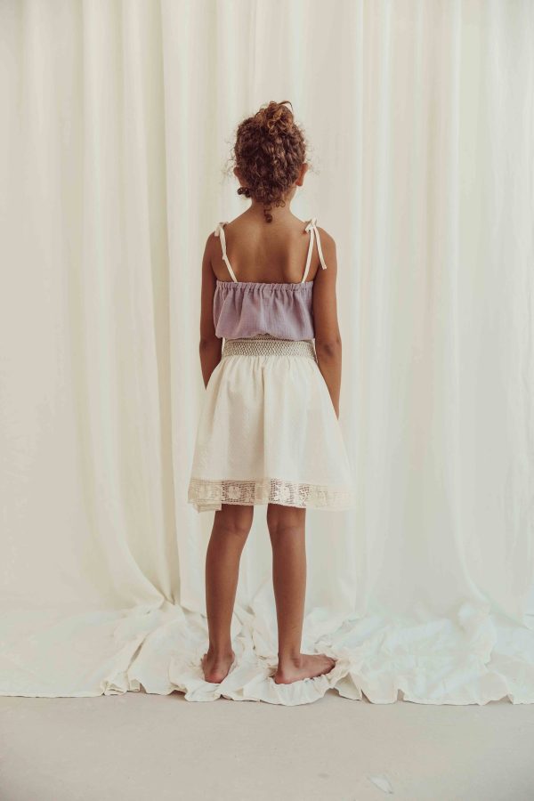 the organic cotton Susa Top in Lavender paired with the Rustic Dobby Skirt by the brand LiiLU