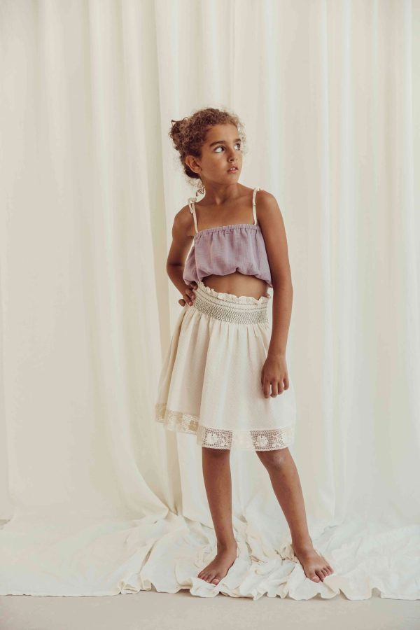 the organic cotton Susa Top in Lavender paired with the Rustic Dobby Skirt by the brand LiiLU