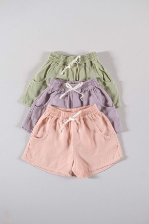 the organic cotton Tudor Shorts in dryed green, lavender & peach by the brand LiiLU