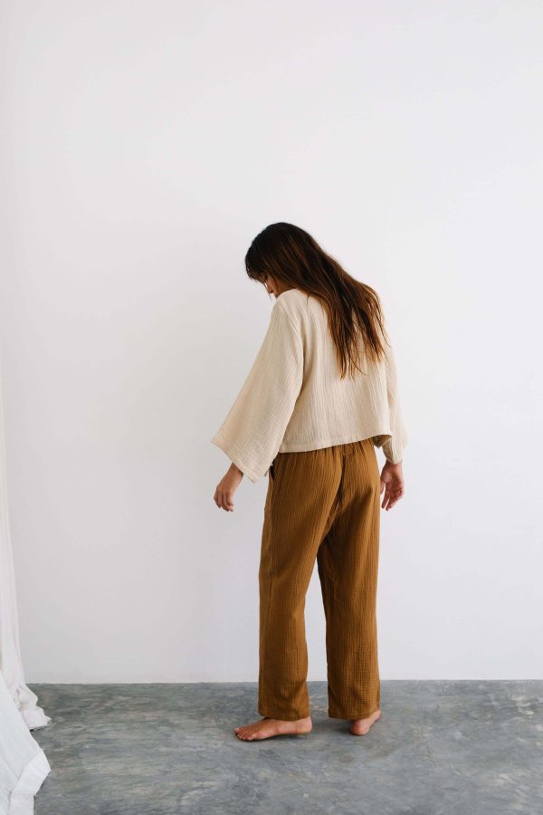 the Mia Pants in Chocolate paired with the Mia Wrap Top in Bone by the Bare Road