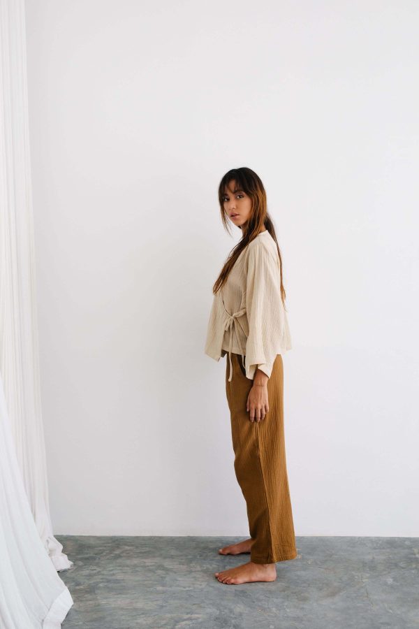 the Mia Pants in Chocolate paired with the Mia Wrap Top in Bone by the Bare Road