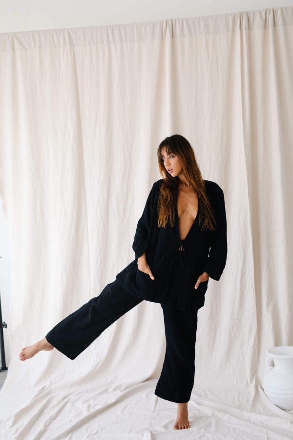 the Nadia Pants in Black paired with the Adley Coat by the Bare Road