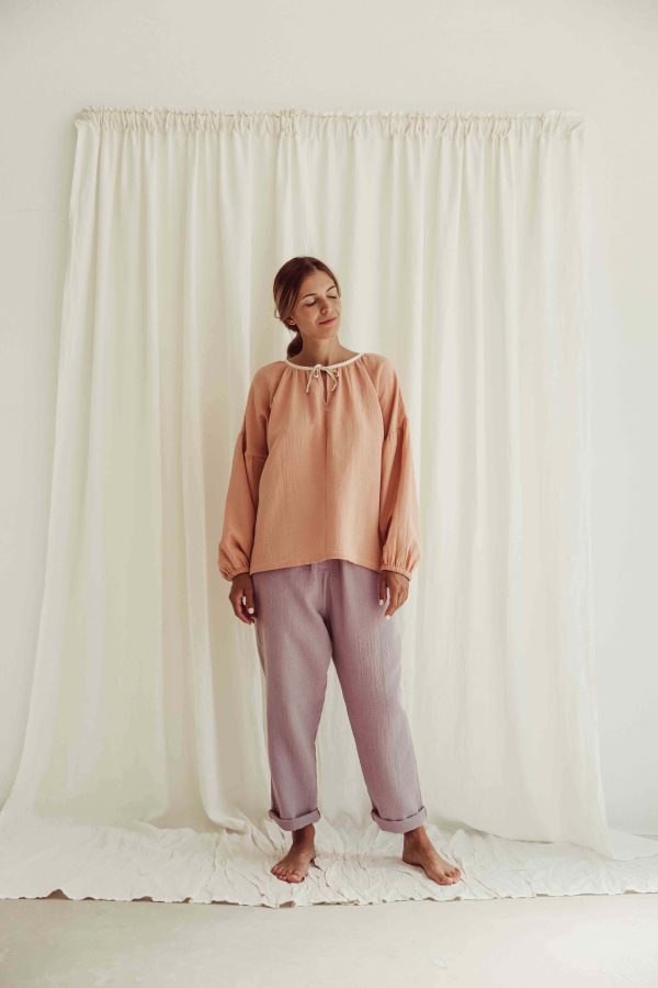 the organic cotton Levi Pants in Lavender paired with the Lili Blouse in Peach by the brand LiiLU