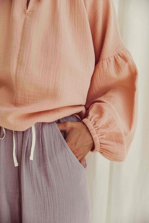 the organic cotton Levi Pants in Lavender paired with the Lili Blouse in Peach by the brand LiiLU