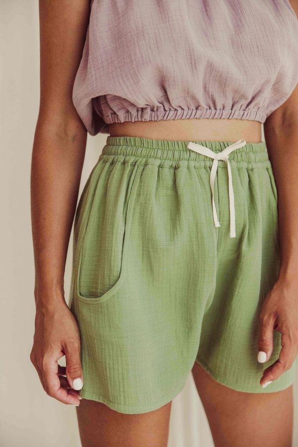 the organic cotton Tudor Shorts in Dryed Green paired with the Susa Top in Lavender by the brand LiiLU