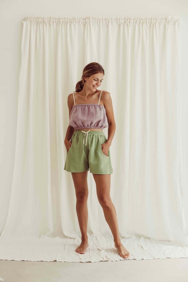 the organic cotton Tudor Shorts in Dryed Green paired with the Susa Top in Lavender by the brand LiiLU