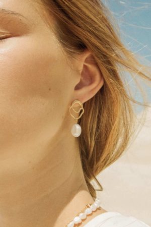 the golden & pearl Célaphine Earrings by the brand Agapé Studio