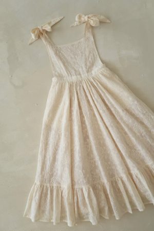 the Fiona Pinafore Dress in Creme Broderie by the brand House of Paloma, curated by Morsel Store