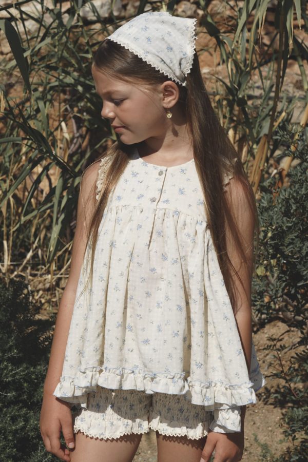 girl wearing the Bijou Top in floral cotton Fleur Bleue paired with the matching Poppi Shorts & head scarf by the Australian brand House of Paloma, curated by Morsel Store