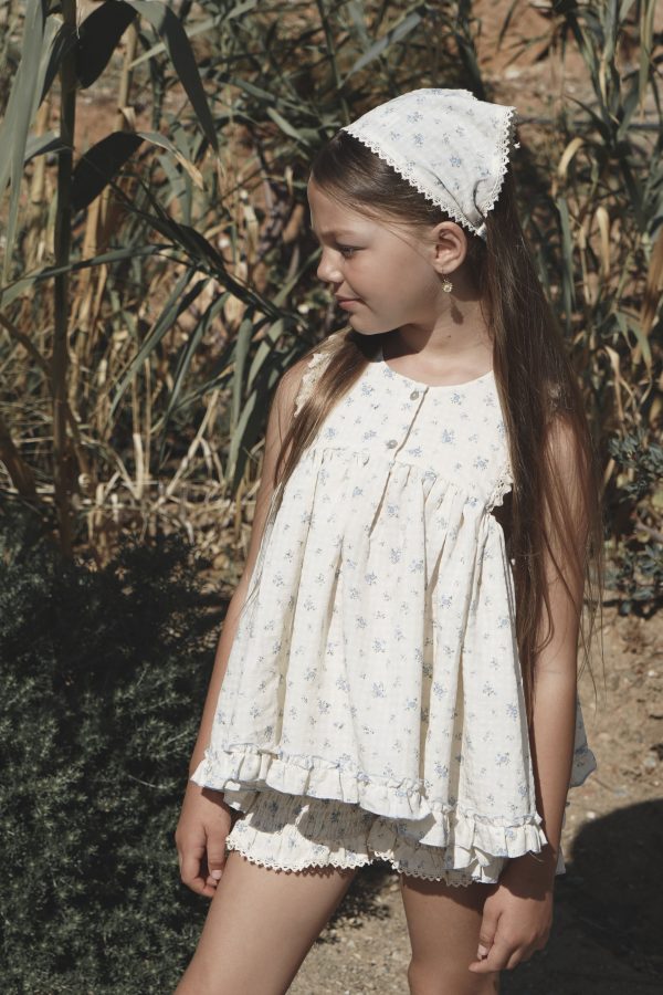 girl wearing the Poppi Short in a floral Fleur Bleue fabric with the matching Bijou Top by the sustainable brand House of Paloma, curated by Morsel Store